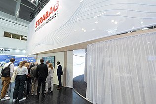 A well-attended panel discussion directly at the booth, showcasing the high level of interest and active audience engagement from trade fair visitors.